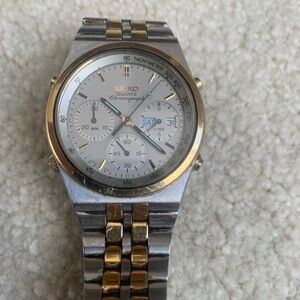 Seiko Presidential men’s 7A38-7280  analog two tone quartz chronograph watch